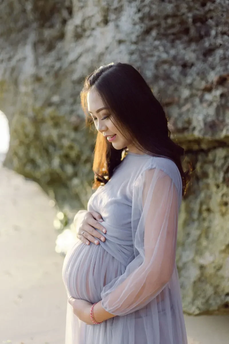 Pregnant woman on beach