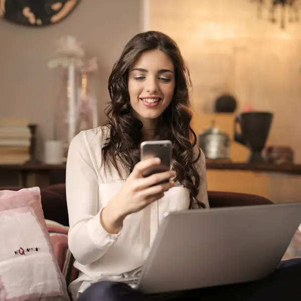 Smiling woman making a phone call