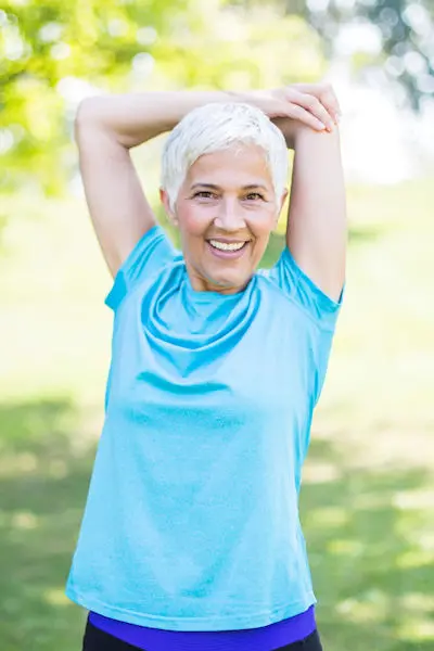 Woman in blue stretching